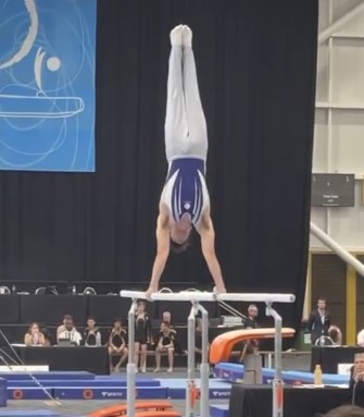 Harrison Higgins on parallel bars