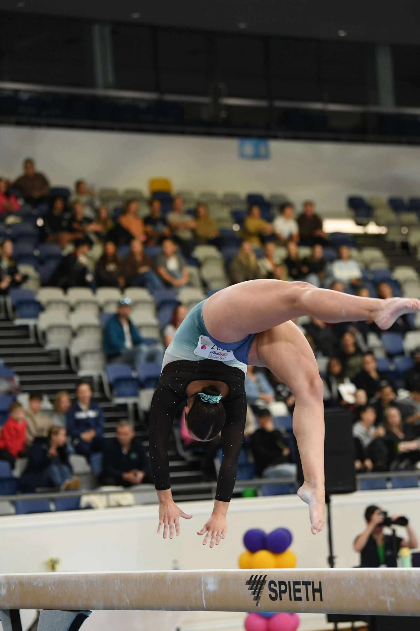 Mia McDowell competing on beam at the 2025 Victorian Championships