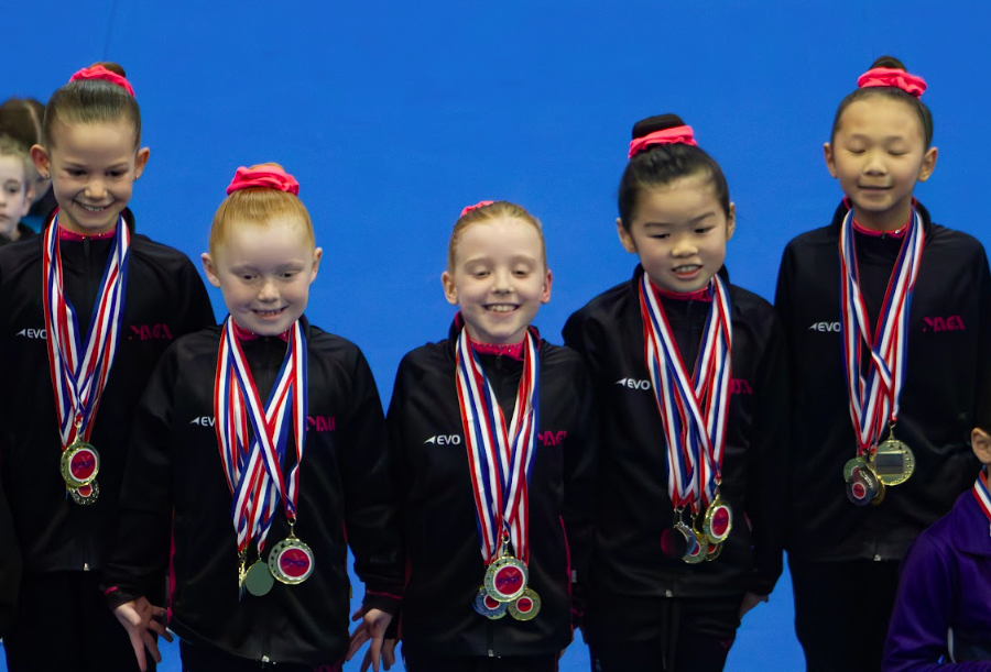 MAGA's Level 4 Division 2 team on the podium at the 2026 Knox WAG Junior Invitational